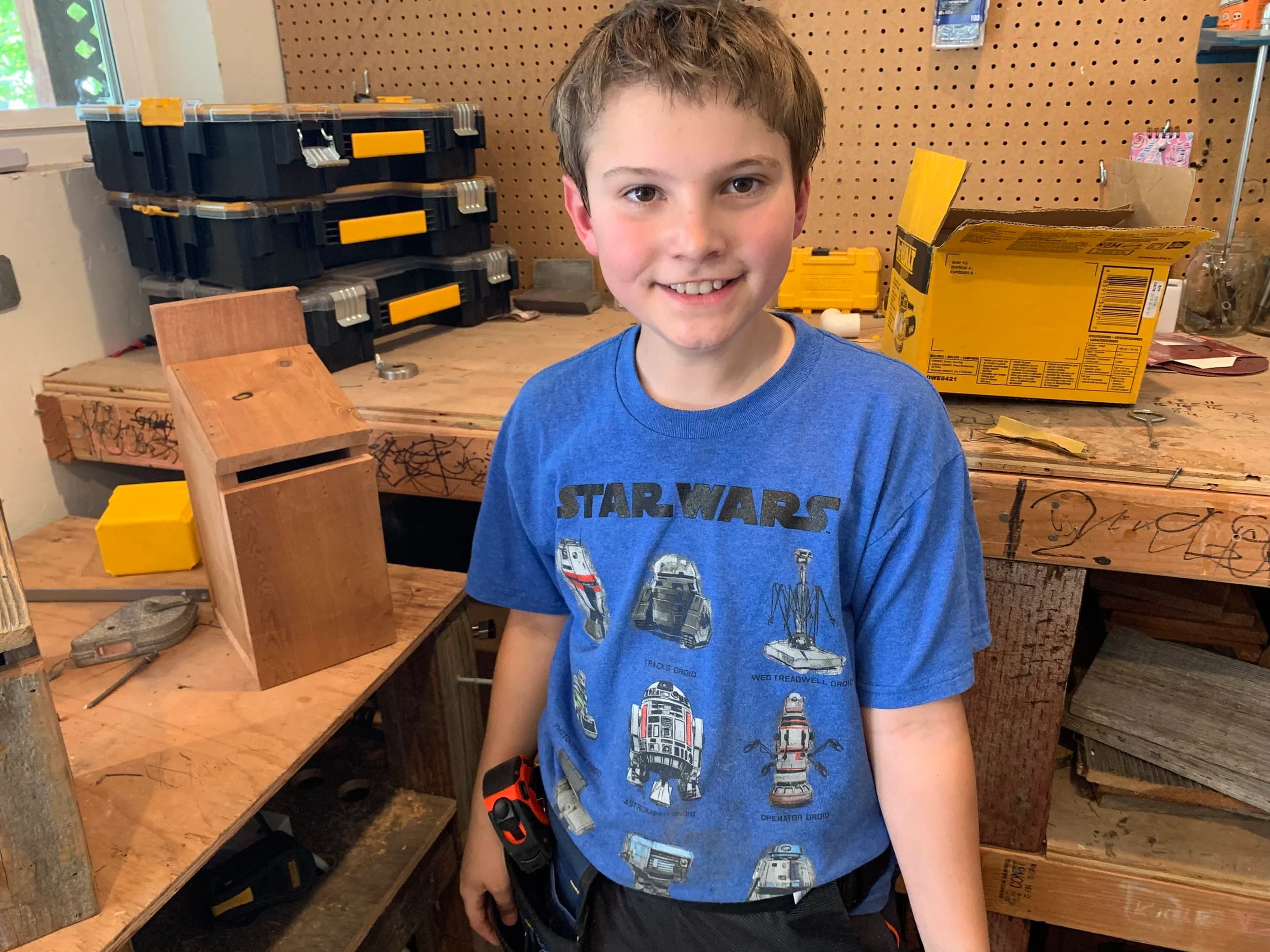 Taylor as a kid in the workshop